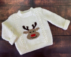 Reindeer Pullover And Mitts | Knit Childs Christmas Sweater Kit -Crocheting Supplies Store ChildsReindeerSweaterondarkwoodbackground